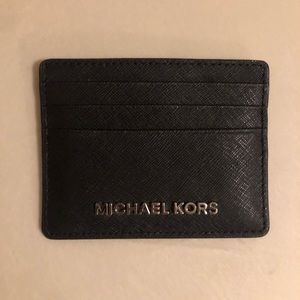 Black and silver Micheal Kors card holder